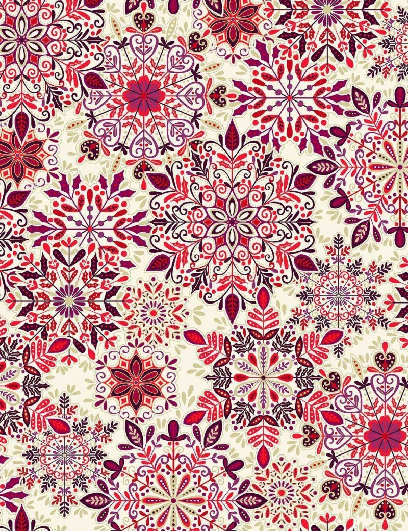 Enchanted Christmas patchwork fabric with snowflake motifs.